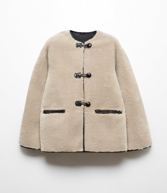 Faux fur coat with applications